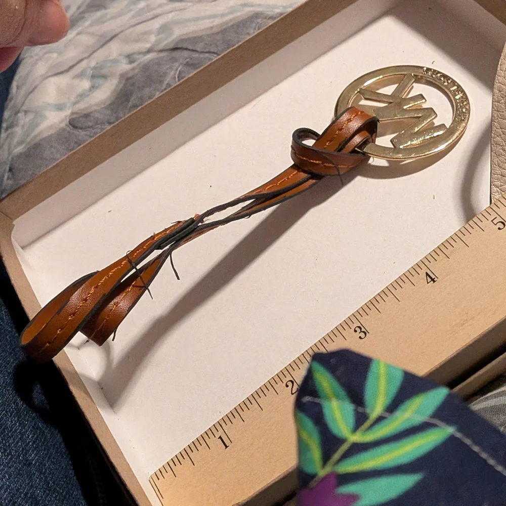 Brown Leather Keychain with Gold Emblem